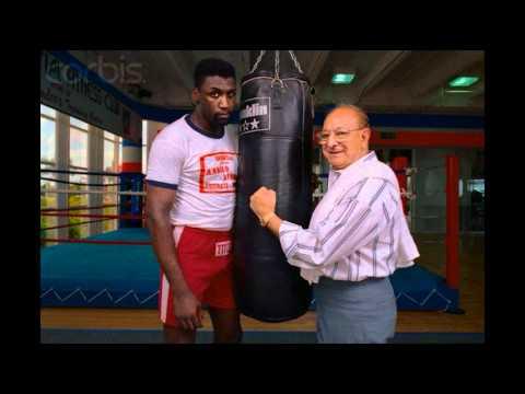 A young Derek at a punchbag in the gym